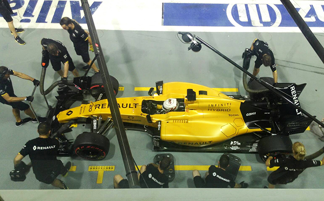 Behind the scenes in a Grand Prix garage with tire-changing action and more.