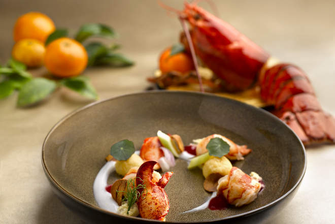 Boston Lobster Deep Fried and served with "Tian Jin" Cabbage Topped with Home-made Cheese and Garlic Sauce